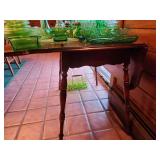 Vintage wood side table featuring turned legs and a polished tabletop with two folding leaves.(Glassware Not included)