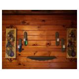 Hanging candle sconces with artwork and shelf