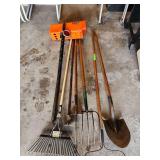 Yard tools rakes shovel hose mailbox