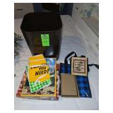 Miscellaneous items. Heavy duty trash bin, reusable bags, puzzles, price stickers etc