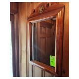 Hanging mirror and flower portrait