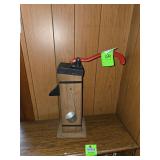 Vintage rustic wooden water pump-style beverage dispenser, commonly used for liquor or other drinks.