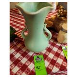 vintage art pottery vase, likely produced by a company such as Weller, McCoy, or Roseville, featuring a pale matte green glaze and double handles