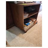 Small TV stand in wheels with contents
