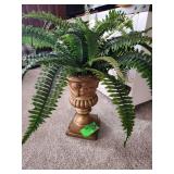 vintage gilded or plaster urn planter featuring cherub sculptures