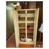 Metal storage cabinet with contents