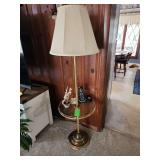 late 20th-century brass floor lamp featuring an integrated glass tabletop with a brass gallery. NO CONTENTS