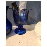 cobalt blue glass vases, stained glass light and decorative picture frame