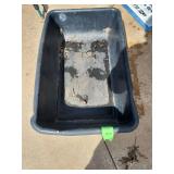 Black plastic tub commonly used as a concrete mixing tub or a utility basin. 32in X 18in