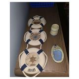 Lighthouse bathroom decor. Soap dish, toothbrush holder, wall art, rug, toilet brush, and waste basket