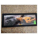 Ford advertisement framed in glass