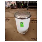 Antique circular trash can filled with microfiber rags