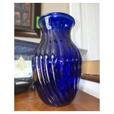 2 blue glass vases