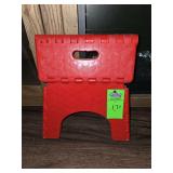 Foldable step stool with safe grip top and 300lb weight capacity