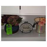 Flowers in decorative vases and friends decor