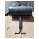 lawn roller, used for leveling lawns, settling newly planted grass seed or sod, and flattening mole or ant hills.