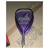 Rep fitness lumbar support cushion and Pro Kennex Prodigy 100 tennis racquet with its protective cover.