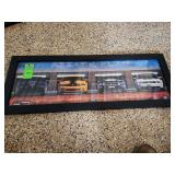 Ford framed in glass advertisement