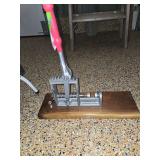 Duke brand lever-action nutcracker, specifically designed for cracking hard-shelled nuts like black walnuts, hickory nuts, and pecans.