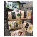 Assorted organic seeds for planting. Broccoli, alfalfa, salad mix, clover, green peas as well as counter top sprout garden
