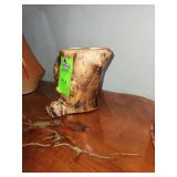 handmade, rustic wooden centerpiece carved from a tree trunk or burl