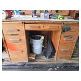 Wooden work desk with contents of drawers