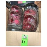 smoke/red lens tail lights, potentially for a 1995-2004 Chevy Blazer or a 1995-2000 Toyota Tacoma