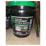 Miscellaneous rakes, shop brooms, unopened bucket of driveway sealer