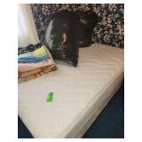 Full size bed with mattress and box spring, bedding