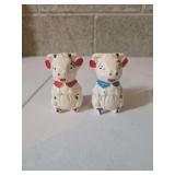 vintage 'APCO' (American Pottery Company) or 'Shawnee Pottery' cow salt and pepper shakers from the 1940s-1950s.