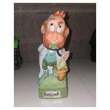 vintage 1970s porcelain decanter and music box from the Hoffman Distilling Co. 'Mr. Lucky' series, specifically the 'Mr. Doctor' leprechaun character
