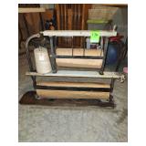 vintage Piqua brand paper cutter and dispenser, features a cast iron frame with wooden components
