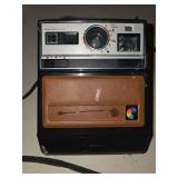 vintage 1970s Kodak Colorburst 100 instant camera features a distinct brown leather-look panel on the front and a rainbow-colored logo.