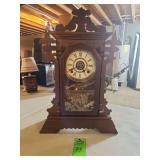 Antique Eastlake-style walnut gingerbread parlor clock