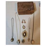 Carved wooden jewelry box with vintage Cameo jewelry