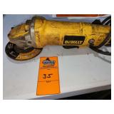 DeWALT corded angle grinder equipped with a grinding or cutting wheel
