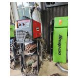 Lincoln MIG welder on stand with tank .