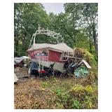Red and silver Tracker aluminum fishing or V-hull boat