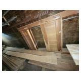 Pile of wood with old bedframe