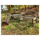 Vintage New Idea / ground-drive side-delivery) pull-type hay rake.