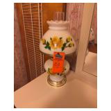 This appears to be a vintage milk glass "Gone with the Wind" style hurricane parlor lamp featuring hand-painted yellow floral and green leaf designs. [1] (https://www.etsy.com/listing/1785473877/vinta