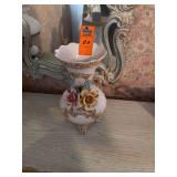 AI Overview        The selected item appears to be a vintage Italian ceramic or porcelain floral vase, reminiscent of Capodimonte or Bassano style decor. [1] (https://www.worthpoint.com/worthopedia/ca
