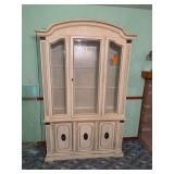 This appears to be a vintage French Provincial or Mediterranean-style china cabinet and hutch. [1] (https://offerup.com/item/detail/2aa6bb4c-77f6-3f20-8ce4-0c060f9a5b5b), [2] (https://www.facebook.com