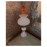 This item appears to be a vintage white hobnail milk glass hurricane or parlor table lamp featuring a ruffled rim shade and a textured, beaded pedestal base.Material & Style: Crafted from opaque white