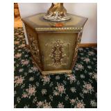 AI Overview        The image shows an ornate, hexagonal gilded cabinet or accent table featuring classical or Baroque-style relief ornamentation. [1] (https://www.estatesales.net/IL/Palos-Hills/60465/