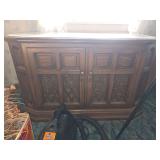 Vintage wooden Zenith Allegro console stereo cabinet with an integrated turntable, AM/FM radio receiver, and an 8-track tape player underneath the top lid.