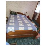 Full size bed with bedding