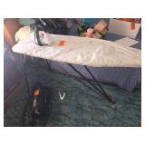 Vintage ironing board with iron