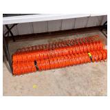 Partial rolls of orange safety fencing