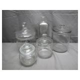 Five Clear Glass Storage Jars